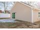 Tan vinyl-sided home with backyard patio at 511 E Sycamore St, Lincolnton, NC 28092