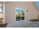 Back exterior view with sliding glass door and patio at 511 E Sycamore St, Lincolnton, NC 28092