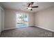 Bedroom with sliding glass doors to backyard at 511 E Sycamore St, Lincolnton, NC 28092