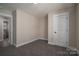 Cozy bedroom featuring grey carpet, a closet, and access to a full bath at 511 E Sycamore St, Lincolnton, NC 28092