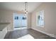 Kitchen dining area with sliding glass door to backyard at 511 E Sycamore St, Lincolnton, NC 28092