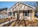 New construction home with a front porch and landscaping at 511 E Sycamore St, Lincolnton, NC 28092