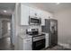 Stainless steel appliances and granite countertops in kitchen at 511 E Sycamore St, Lincolnton, NC 28092