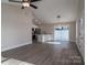 Open living room with hardwood floors and ceiling fan at 511 E Sycamore St, Lincolnton, NC 28092