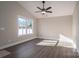 Spacious living room featuring hardwood floors and a ceiling fan at 511 E Sycamore St, Lincolnton, NC 28092