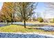 Large backyard with trees and patchy snow on the ground at 678 Wagner St, Troutman, NC 28166