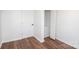 Simple bedroom with wood-look floors and a closet at 678 Wagner St, Troutman, NC 28166