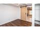 Bedroom with light walls, wood-look floors, and a barn door at 678 Wagner St, Troutman, NC 28166