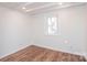 Spacious bedroom with wood floors and a window at 678 Wagner St, Troutman, NC 28166