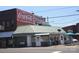 Green commercial building with Coca-Cola mural beside it at 678 Wagner St, Troutman, NC 28166