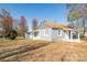 Gray house with white trim, front and side porches, and shed at 678 Wagner St, Troutman, NC 28166