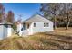 Gray house with white trim, front porch, and shed at 678 Wagner St, Troutman, NC 28166