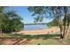 Sandy beach with lake access and volleyball nets at 678 Wagner St, Troutman, NC 28166