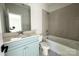 Bathroom with a combined tub and shower, toilet, vanity with countertop, and a large mirror at 1875 Rock Hill Church Rd # 4, Matthews, NC 28104