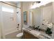 Well-lit bathroom features a tub-shower combo with white subway tile and a granite vanity at 1875 Rock Hill Church Rd # 4, Matthews, NC 28104