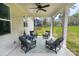 Covered back porch with a ceiling fan and comfortable seating, ideal for outdoor relaxation at 1875 Rock Hill Church Rd # 4, Matthews, NC 28104