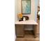 Charming desk nook with granite countertop, wood cabinetry, and a modern painting at 1875 Rock Hill Church Rd # 4, Matthews, NC 28104