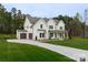 Charming two-story home featuring a two car garage and a well-manicured front yard at 1875 Rock Hill Church Rd # 4, Matthews, NC 28104