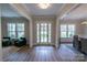 Bright foyer featuring wood flooring, double doors, and views into the living spaces at 1875 Rock Hill Church Rd # 4, Matthews, NC 28104
