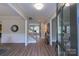 Inviting foyer featuring wood flooring, a staircase, and a view into the living spaces at 1875 Rock Hill Church Rd # 4, Matthews, NC 28104