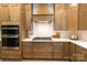 Kitchen with custom cabinets, stainless steel appliances, and white countertops at 1875 Rock Hill Church Rd # 4, Matthews, NC 28104