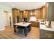 Spacious kitchen with custom cabinets, a center island, and modern appliances at 1875 Rock Hill Church Rd # 4, Matthews, NC 28104