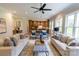 Spacious living room with hardwood floors, large windows, and an open concept floorplan at 1875 Rock Hill Church Rd # 4, Matthews, NC 28104