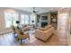 Comfortable living room with built-in shelving, a fireplace, and plenty of natural light at 1875 Rock Hill Church Rd # 4, Matthews, NC 28104