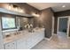 Bright main bathroom featuring a double vanity, large mirror, and a luxurious soaking tub with separate shower at 1875 Rock Hill Church Rd # 4, Matthews, NC 28104