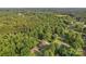 Overhead view of a brick home surrounded by dense trees in a quiet, well-maintained neighborhood at 216 Delview Dr, Cherryville, NC 28021