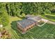 Aerial view of a brick home with landscaping and a walkway to the front door at 216 Delview Dr, Cherryville, NC 28021