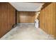 Spacious basement area with wood paneling, offering versatile potential for various uses and ample storage space at 216 Delview Dr, Cherryville, NC 28021