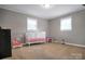 Bedroom with carpeted floors and a white crib at 216 Delview Dr, Cherryville, NC 28021