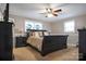 Bedroom with dark wood furniture, a ceiling fan, and a window at 216 Delview Dr, Cherryville, NC 28021