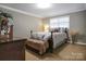 Serene bedroom with a queen-sized bed, neutral walls, and carpeted floor at 216 Delview Dr, Cherryville, NC 28021
