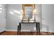 Elegant entryway featuring a decorative mirror, lamps, and stylish table with hardwood flooring at 216 Delview Dr, Cherryville, NC 28021