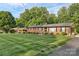 A beautiful brick home with mature trees and a green lawn at 216 Delview Dr, Cherryville, NC 28021