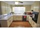 Bright kitchen featuring plenty of counter space, appliances, and rich hardwood flooring at 216 Delview Dr, Cherryville, NC 28021