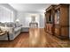 Spacious living room featuring hardwood floors, a large window, and custom built-in shelving at 216 Delview Dr, Cherryville, NC 28021
