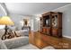 Inviting living room with hardwood floors, a built-in entertainment center, and neutral décor at 216 Delview Dr, Cherryville, NC 28021