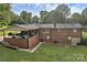 A brick home with a carport and a well-manicured lawn at 216 Delview Dr, Cherryville, NC 28021