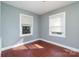 Bright bedroom featuring neutral paint, and ample natural light from two windows at 2630 Druid Hills Way, Charlotte, NC 28206