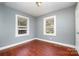 Gray walls, wood floors, and two windows at 2630 Druid Hills Way, Charlotte, NC 28206