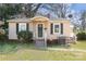 Charming single-story home with a well-maintained front yard, dark shutters and porch at 2630 Druid Hills Way, Charlotte, NC 28206