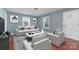 Bright living room with stylish decor, hardwood floors, light blue walls, and comfortable seating at 2630 Druid Hills Way, Charlotte, NC 28206