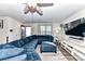 Living room with sectional sofa, large TV, and ceiling fan at 3218 Bouquet St, Charlotte, NC 28215