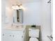 Clean bathroom with white vanity, toilet, and tiled walls at 4754 Hedgemore Dr # S, Charlotte, NC 28209
