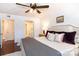 King-size bed, en-suite bathroom access, and laundry area at 4754 Hedgemore Dr # S, Charlotte, NC 28209