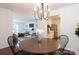 Bright dining room features a wooden table and chairs, with kitchen views at 4754 Hedgemore Dr # S, Charlotte, NC 28209