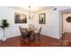 Charming dining area with hardwood floors and modern chandelier at 4754 Hedgemore Dr # S, Charlotte, NC 28209